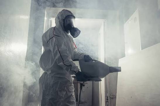 Peak Bio-Clean technician in protective gear during a biohazard cleanup